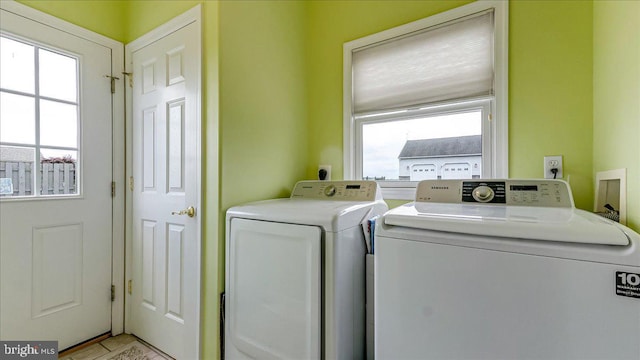 washroom with independent washer and dryer and plenty of natural light