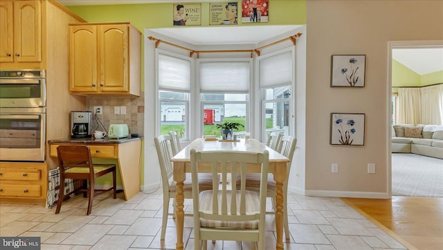 dining room featuring baseboards