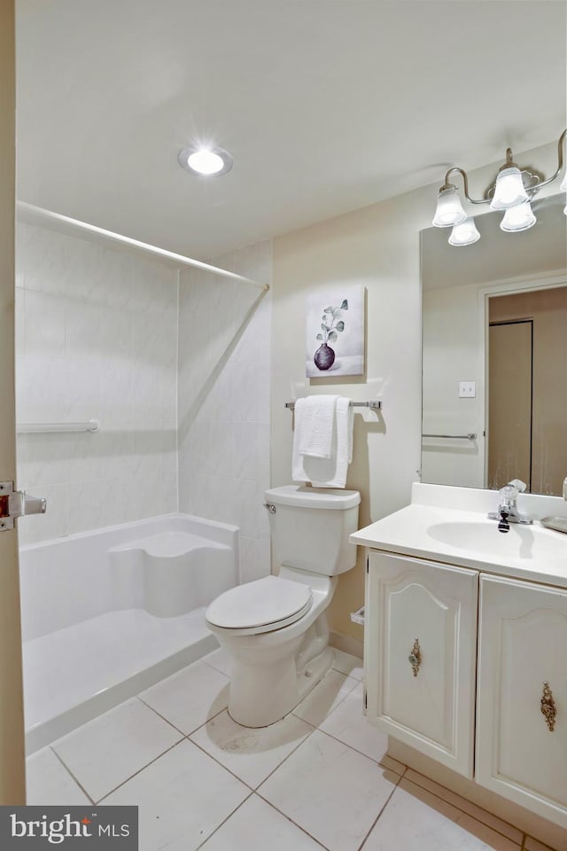 5300 Holmes Run Pkwy Unit 407, Alexandria, VA 22304 - bathroom featuring a shower, toilet, vanity, and tile patterned floors
