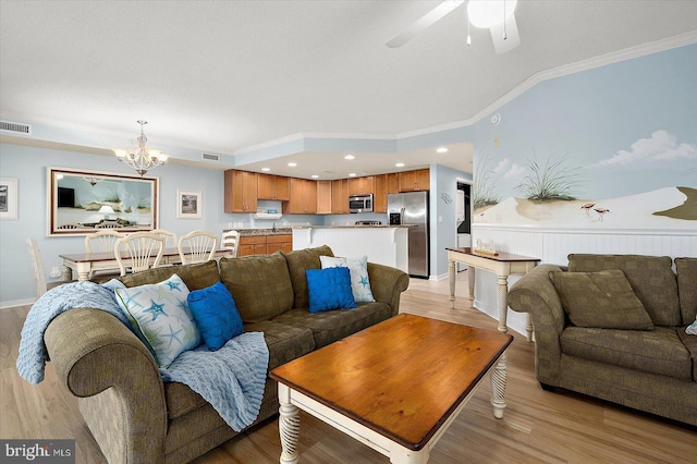 18 79th St Unit 403, Ocean City, MD 21842 - living area featuring ornamental molding, a chandelier, light wood-style flooring, ceiling fan, and lofted ceiling