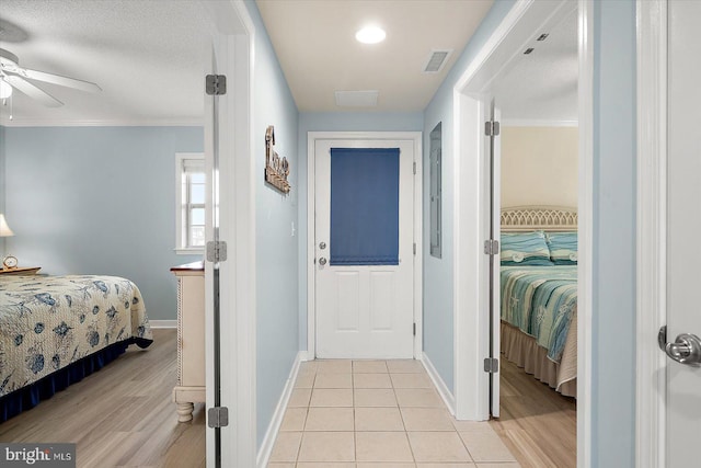 18 79th St Unit 403, Ocean City, MD 21842 - corridor with baseboards, light wood finished floors, and crown molding