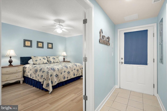 18 79th St Unit 403, Ocean City, MD 21842 - bedroom featuring baseboards, light tile patterned floors, and a ceiling fan