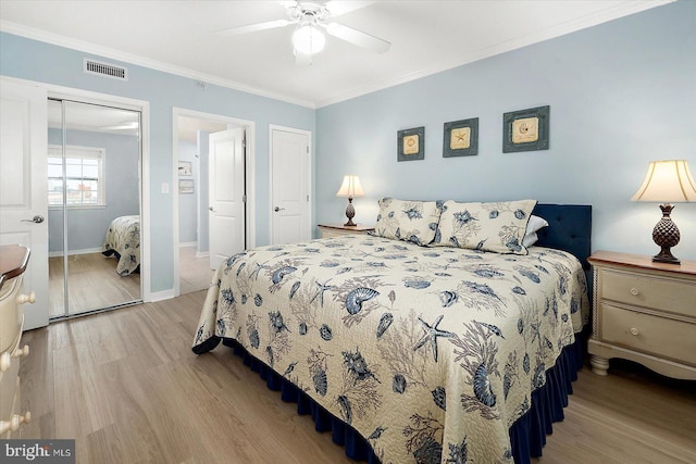 18 79th St Unit 403, Ocean City, MD 21842 - bedroom with wood finished floors, crown molding, a closet, a ceiling fan, and baseboards