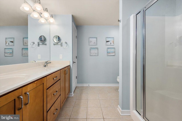 18 79th St Unit 403, Ocean City, MD 21842 - bathroom with a stall shower, baseboards, tile patterned flooring, and double vanity
