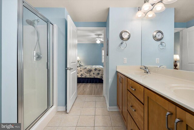 18 79th St Unit 403, Ocean City, MD 21842 - ensuite bathroom with baseboards, tile patterned flooring, and a stall shower