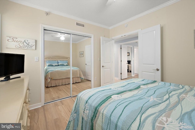 18 79th St Unit 403, Ocean City, MD 21842 - bedroom featuring light wood-type flooring, crown molding, a closet, and baseboards
