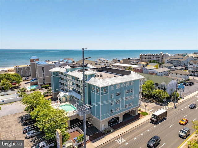 18 79th St Unit 403, Ocean City, MD 21842 - drone / aerial view of a pool and a nearby body of water