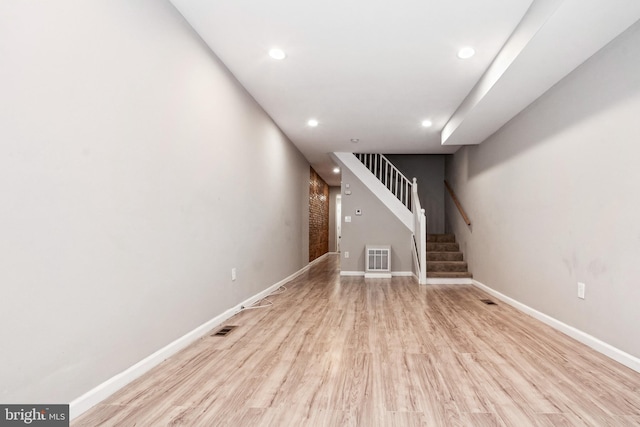 2012 Eagle St, Baltimore, MD 21223 - unfurnished living room with baseboards, light wood-style flooring, stairs, and recessed lighting