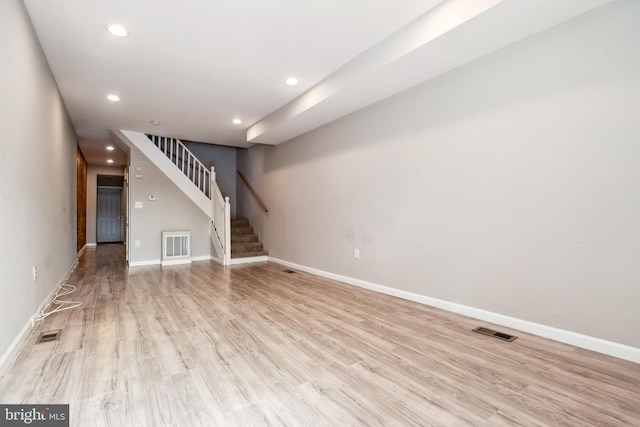 2012 Eagle St, Baltimore, MD 21223 - unfurnished living room with stairway, light wood-style floors, recessed lighting, and visible vents