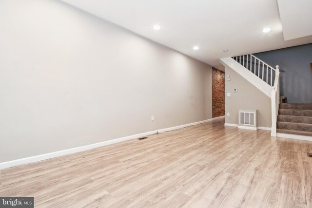 2012 Eagle St, Baltimore, MD 21223 - unfurnished living room featuring visible vents, recessed lighting, stairs, and light wood-style floors