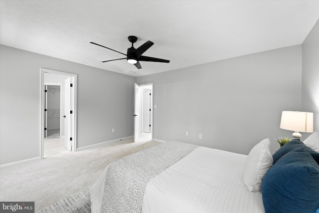 bedroom with light carpet, baseboards, and ceiling fan