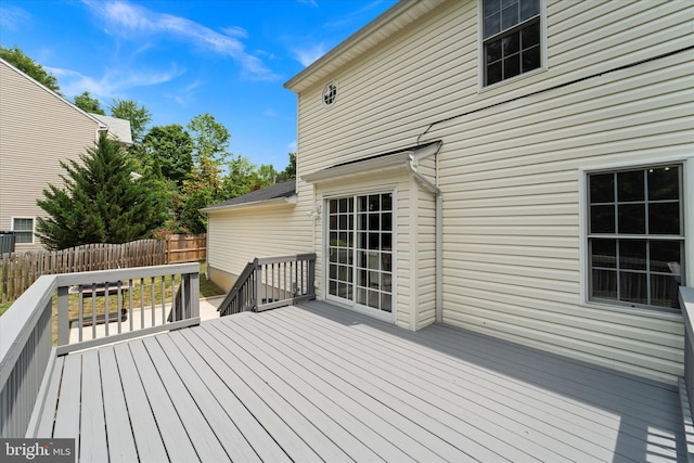 wooden terrace featuring fence
