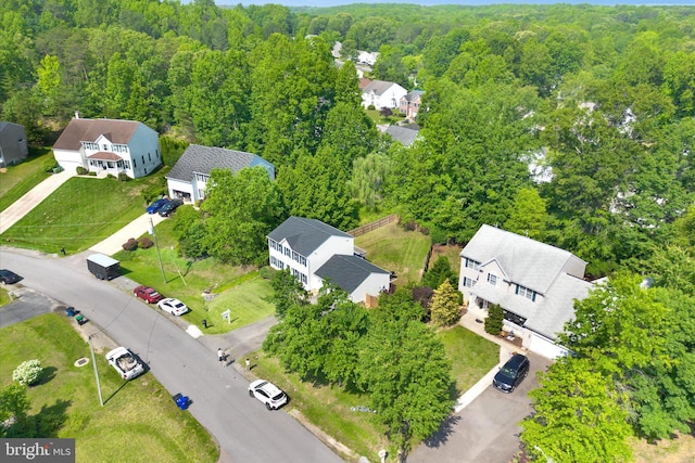 aerial perspective of suburban area featuring a forest