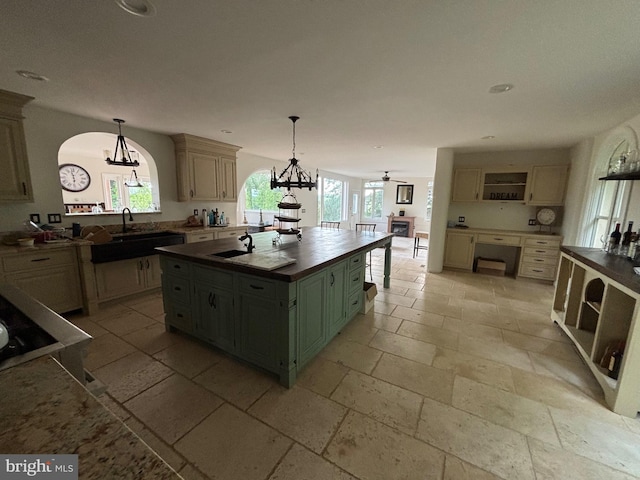 11500 Springridge Rd, Potomac, MD 20854 - kitchen with plenty of natural light, stone tile flooring, open shelves, a chandelier, and recessed lighting