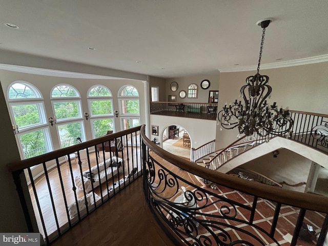 11500 Springridge Rd, Potomac, MD 20854 - stairway with a chandelier, wood finished floors, and crown molding