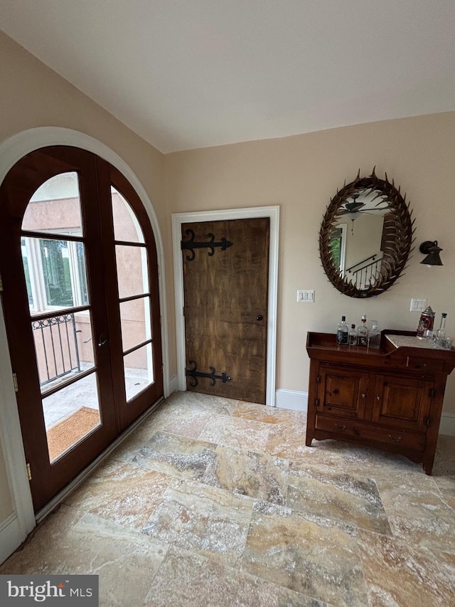 11500 Springridge Rd, Potomac, MD 20854 - entrance foyer with arched walkways, french doors, and baseboards