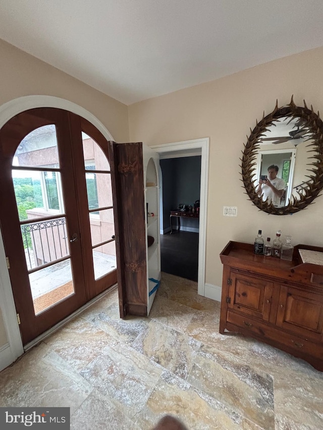 11500 Springridge Rd, Potomac, MD 20854 - entryway featuring arched walkways, french doors, and stone finish flooring