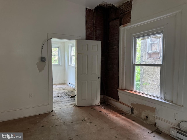 531 N 63rd St, Philadelphia, PA 19151 - spare room with brick wall and a healthy amount of sunlight