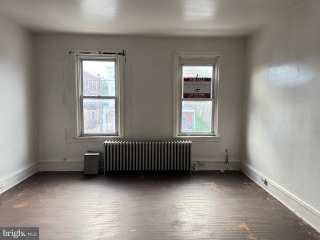 531 N 63rd St, Philadelphia, PA 19151 - empty room featuring wood finished floors, baseboards, and radiator heating unit
