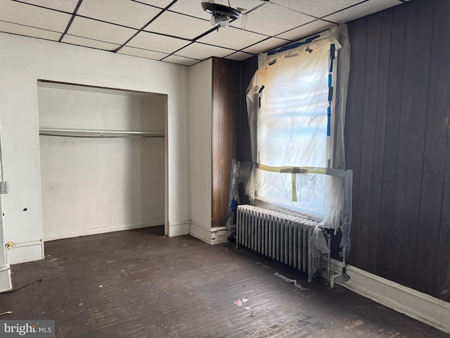 531 N 63rd St, Philadelphia, PA 19151 - unfurnished bedroom featuring a closet, radiator, a drop ceiling, and hardwood / wood-style flooring