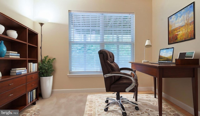 office space with baseboards