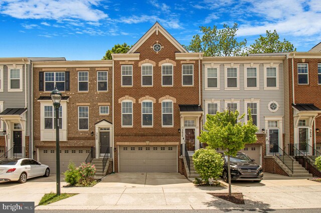 3626 Doc Berlin Dr, Silver Spring, MD 20906 - view of property with a garage, driveway, and brick siding