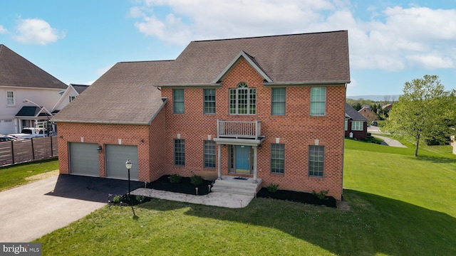 171 Celestial Ter, Greencastle, PA 17225 - colonial-style house featuring driveway, an attached garage, brick siding, and roof with shingles