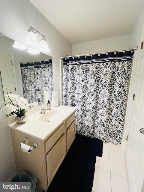 9000 Bay Ave Unit 209, North Beach, MD 20714 - full bath featuring vanity and tile patterned flooring