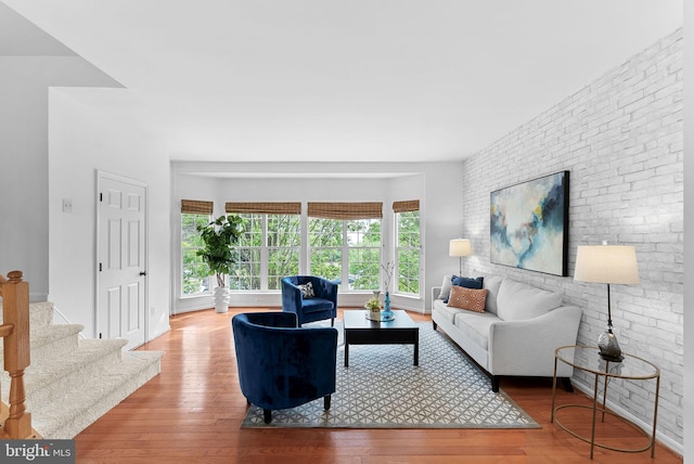 2505 Wheat Meadow Ct, Herndon, VA 20171 - living room featuring wood-type flooring and brick wall