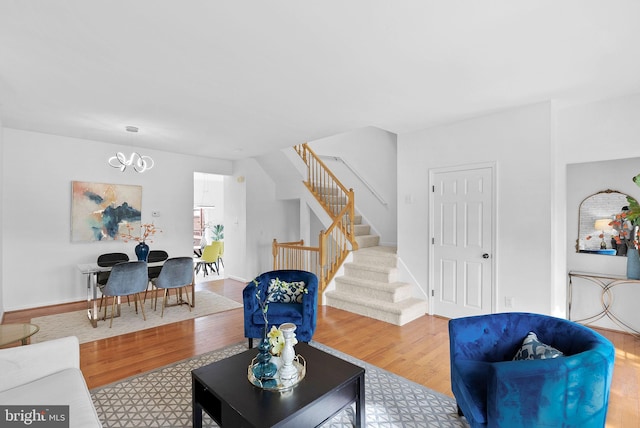 2505 Wheat Meadow Ct, Herndon, VA 20171 - living room featuring wood finished floors, stairs, a chandelier, and baseboards