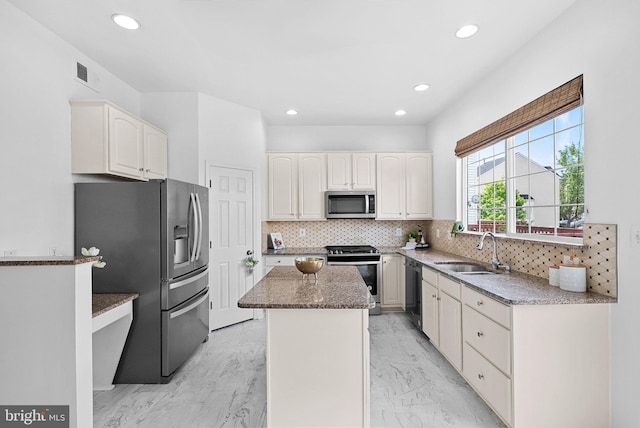 2505 Wheat Meadow Ct, Herndon, VA 20171 - kitchen with appliances with stainless steel finishes, a sink, a kitchen island, dark stone countertops, and backsplash