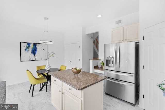 2505 Wheat Meadow Ct, Herndon, VA 20171 - kitchen with stainless steel refrigerator with ice dispenser, a kitchen island, light marble finish flooring, white cabinets, and recessed lighting