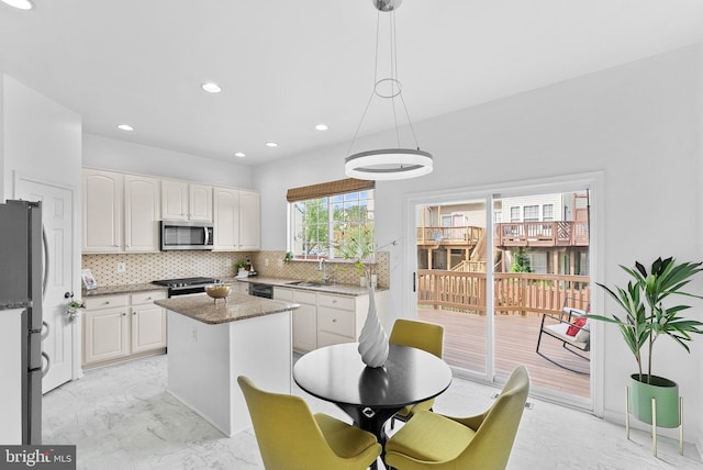 2505 Wheat Meadow Ct, Herndon, VA 20171 - kitchen featuring stainless steel microwave, freestanding refrigerator, backsplash, white cabinets, and dark stone countertops
