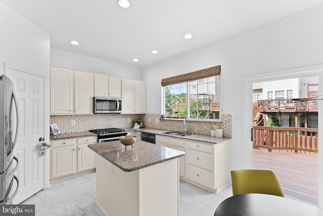 2505 Wheat Meadow Ct, Herndon, VA 20171 - kitchen with appliances with stainless steel finishes, a sink, light marble finish flooring, stone counters, and recessed lighting
