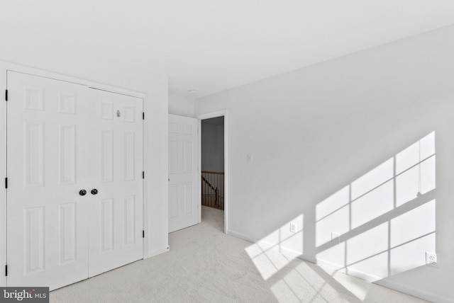 2505 Wheat Meadow Ct, Herndon, VA 20171 - unfurnished bedroom featuring carpet flooring, a closet, and baseboards