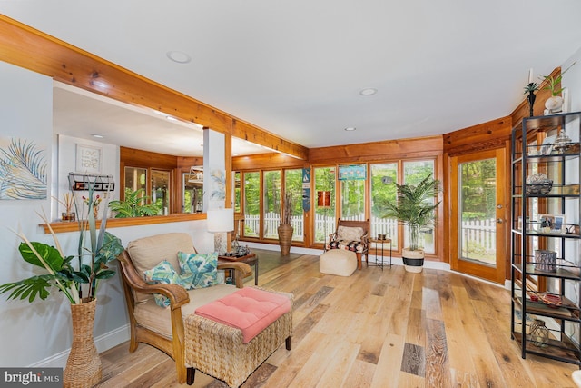 sunroom with recessed lighting, baseboards, french doors, and wood finished floors