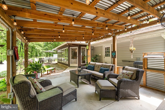 view of patio with an outdoor living space, a pergola, and a sunroom