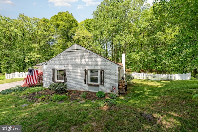 view of outbuilding with fence