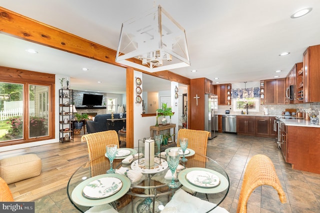 dining area featuring a chandelier and recessed lighting