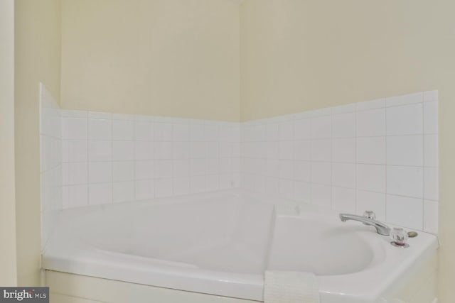 bathroom with a garden tub
