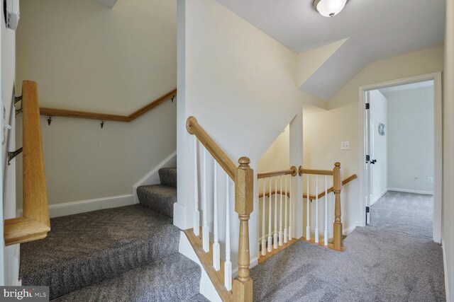 staircase with carpet and baseboards