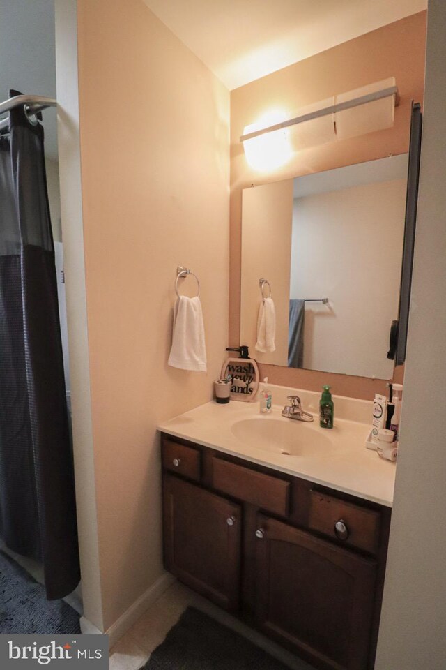 230 Jewel Dr, York, PA 17404 - full bathroom featuring vanity, curtained shower, and tile patterned floors
