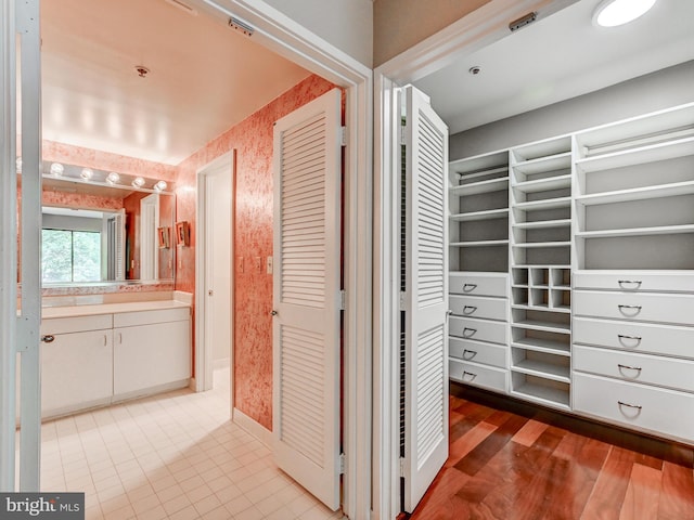 1 Gristmill Ct Unit 103, Pikesville, MD 21208 - hallway featuring wallpapered walls and light tile patterned floors