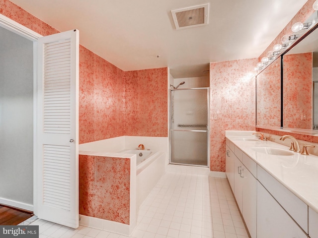 1 Gristmill Ct Unit 103, Pikesville, MD 21208 - bathroom featuring wallpapered walls, a garden tub, a stall shower, double vanity, and baseboards