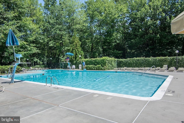 1 Gristmill Ct Unit 103, Pikesville, MD 21208 - community pool featuring a patio area and fence