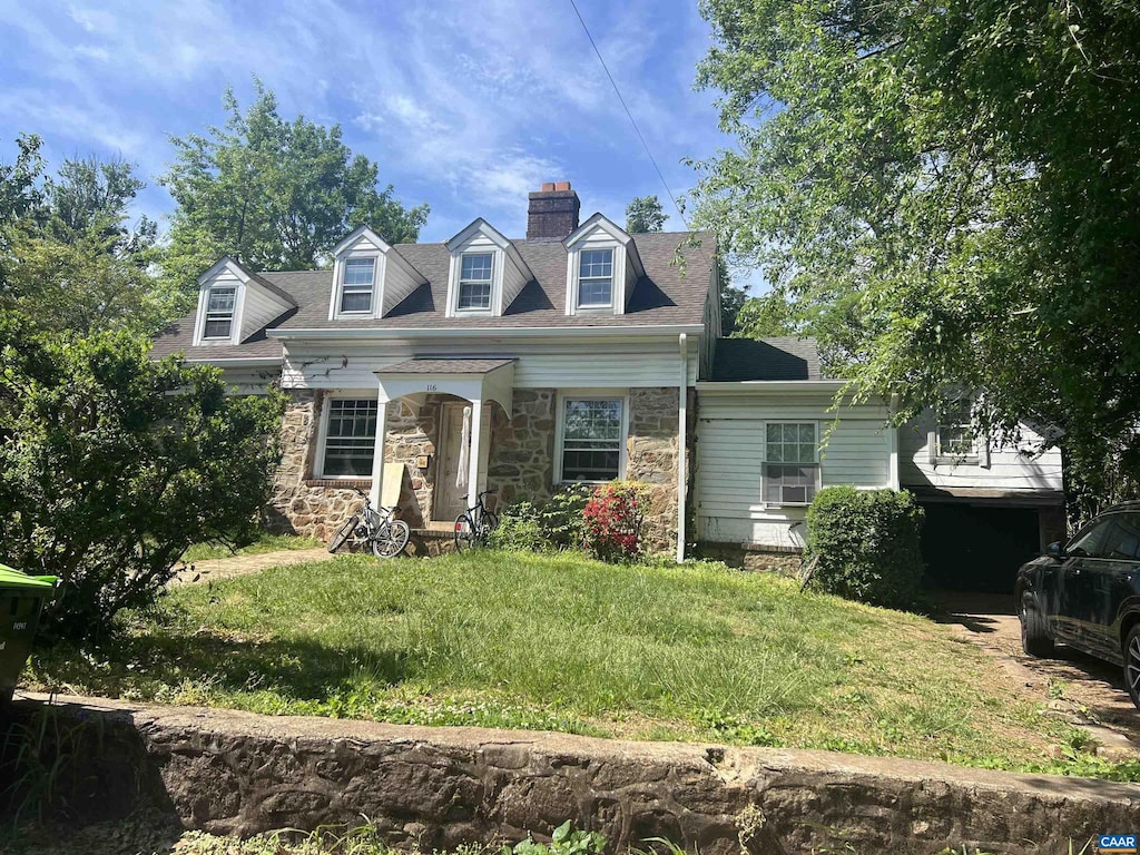 116 Washington Ave, Charlottesville, VA 22903 - cape cod-style house with a front yard, stone siding, and a chimney