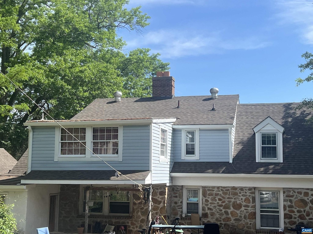 116 Washington Ave, Charlottesville, VA 22903 - view of front facade featuring a chimney, a shingled roof, and stone siding