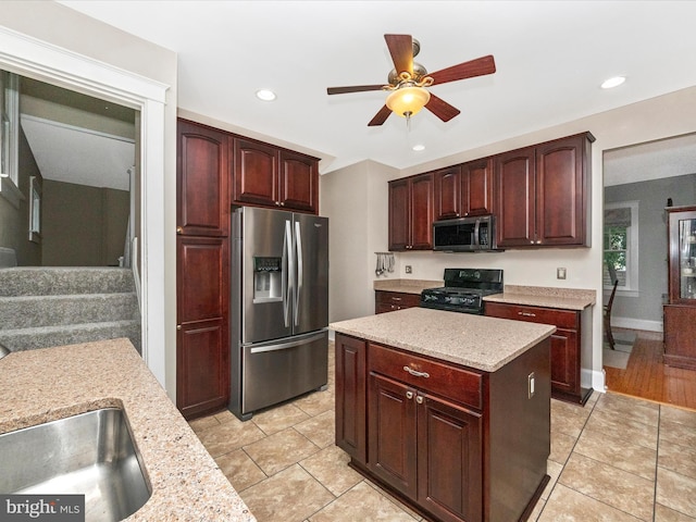 kitchen featuring stainless steel appliances, light tile patterned flooring, ceiling fan, and recessed lighting