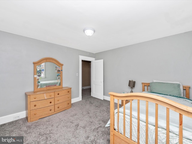 bedroom featuring baseboards and carpet floors