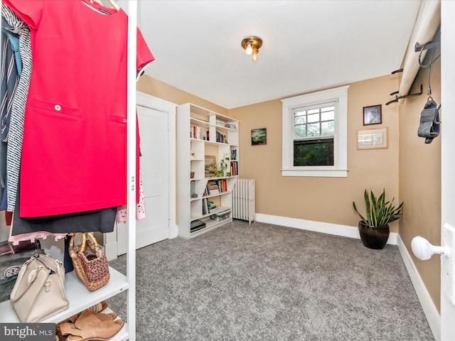 interior space with baseboards and radiator heating unit